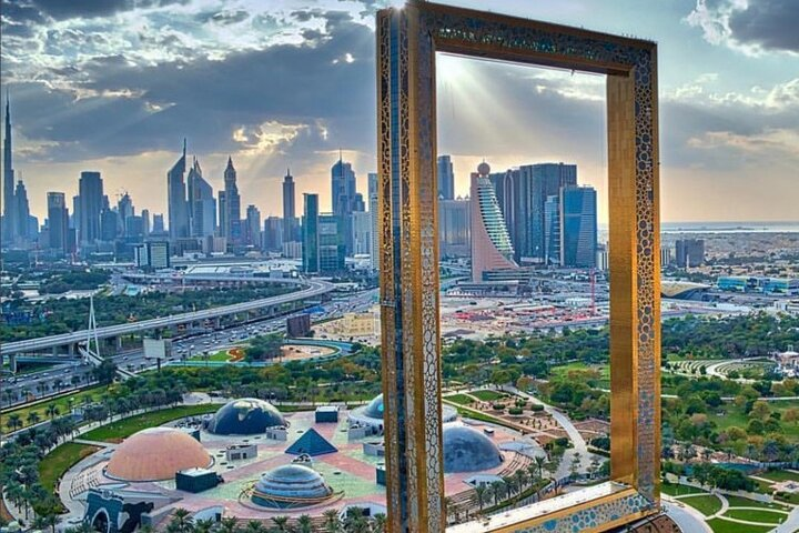 Experience breathtaking views as the Dubai Frame beautifully contrasts the city's historical roots with its modern skyline showcasing the remarkable evolution of this iconic destination.